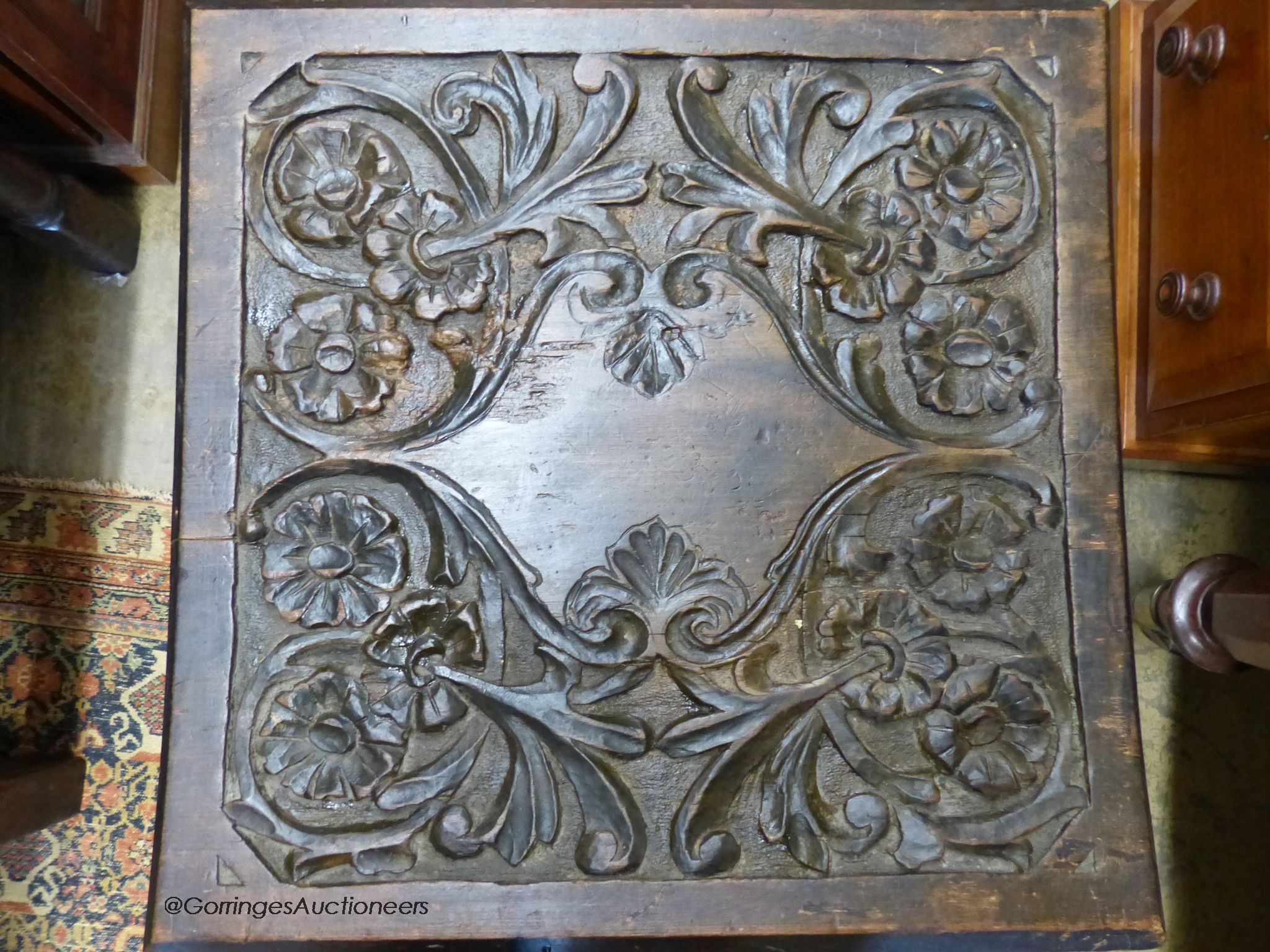 A 17th century style oak armchair and a square occasional table.